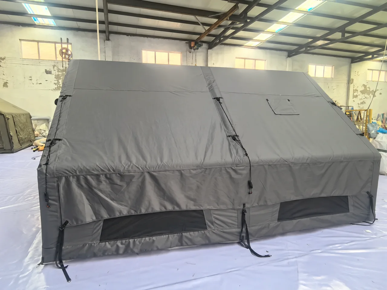 LT-12 inflatable family tent in the workshop, showing its side openings and window covers