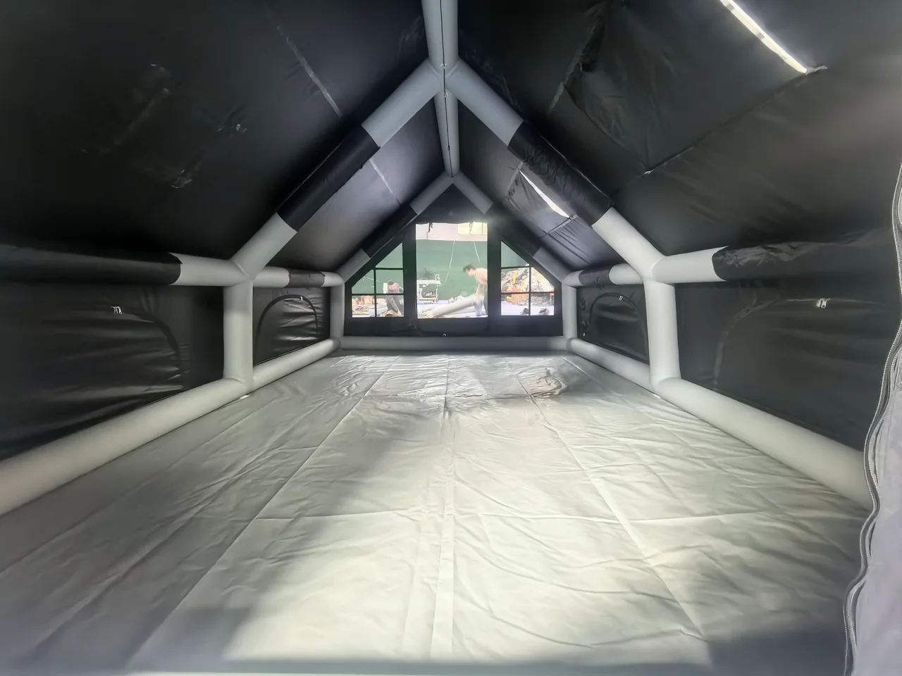Interior of an LT-12 inflatable cabin tent showing the air frame and floor